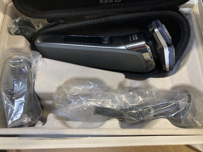 Photo 1 of Philips Norelco Shaver 7300, Rechargeable Wet & Dry Electric Shaver with SenseIQ Technology, Pop-up Trimmer, Charging Stand, Click-on Nose Trimmer, & Travel Case, S7887/92