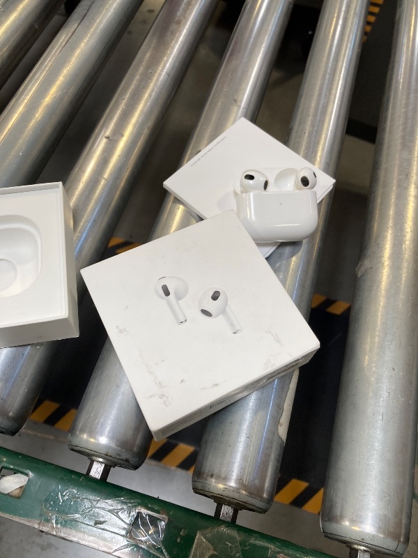 Photo 1 of USED-Needs cleaning--Apple AirPods (3rd Generation) Wireless Ear Buds, Bluetooth Headphones, Personalized Spatial Audio, Sweat and Water Resistant, Lightning Charging Case Included, Up to 30 Hours of Battery Life