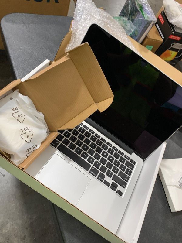 Photo 1 of Apple MacBook Pro with Intel Core i5, (13.3-Inch, 8GB, 512GB) - Silver (Renewed)