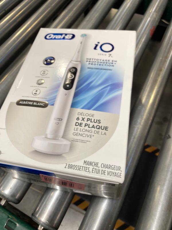 Photo 1 of Oral-B iO Deep Clean + Protect Rechargeable Electric Toothbrush, White with a iO Series 7 Toothbrush, 2 Replacement Brush Heads, and a Charging Travel Case