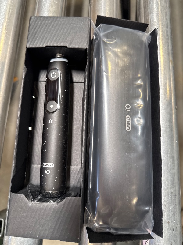 Photo 1 of Oral-B iO Series 10 Rechargeable Electric Toothbrush with Visible Pressure Sensor to Protect Gums, 2 Min Timer, 7 Cleaning Settings, 4 Replacement Toothbrush Heads, and Charging Travel Case, Black