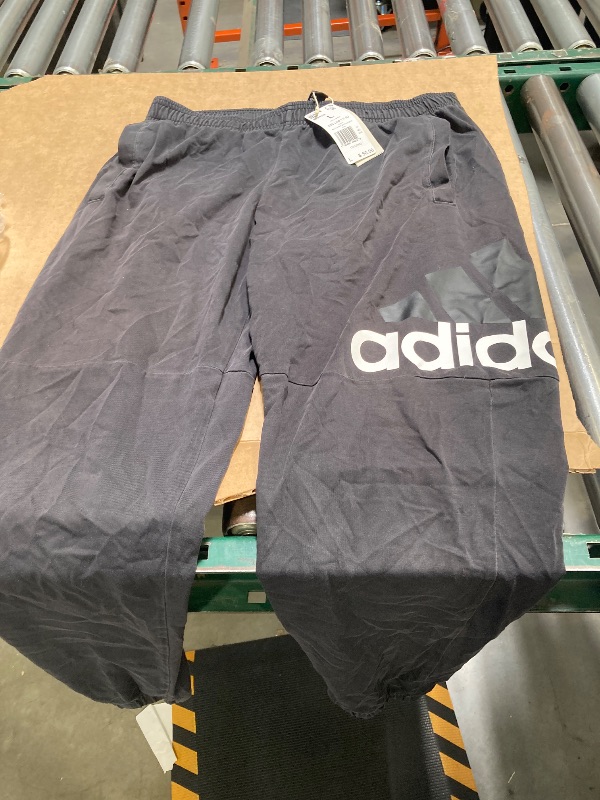 Photo 1 of adidas Men's Essentials Single Jersey Tapered Badge of Sport Pants, Black, Large
