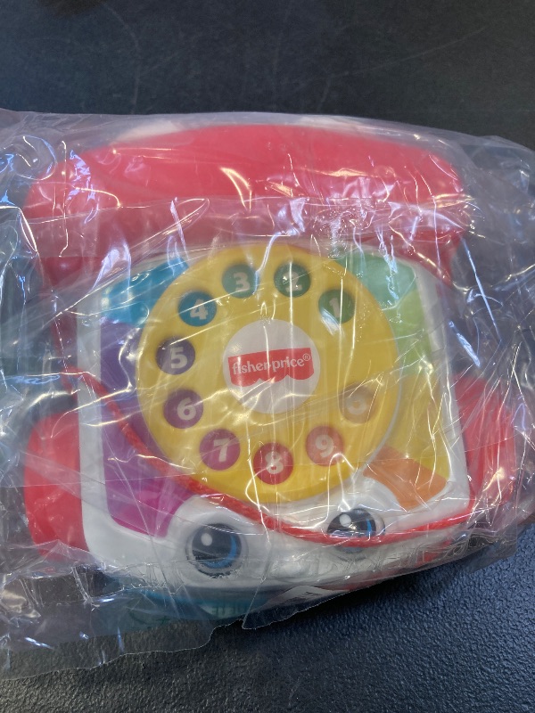 Photo 1 of Fisher-Price Toddler Pull Toy Chatter Telephone Pretend Phone with Rotary Dial and Wheels for Walking Play Ages 1+ years