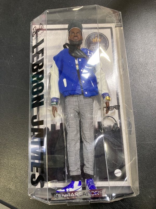 Photo 1 of Barbie Signature Lebron James Kenbassadors Doll Collectible with Varsity Bomber Jacket Outfit & Accessories Including Headphones, Sunglasses, & More