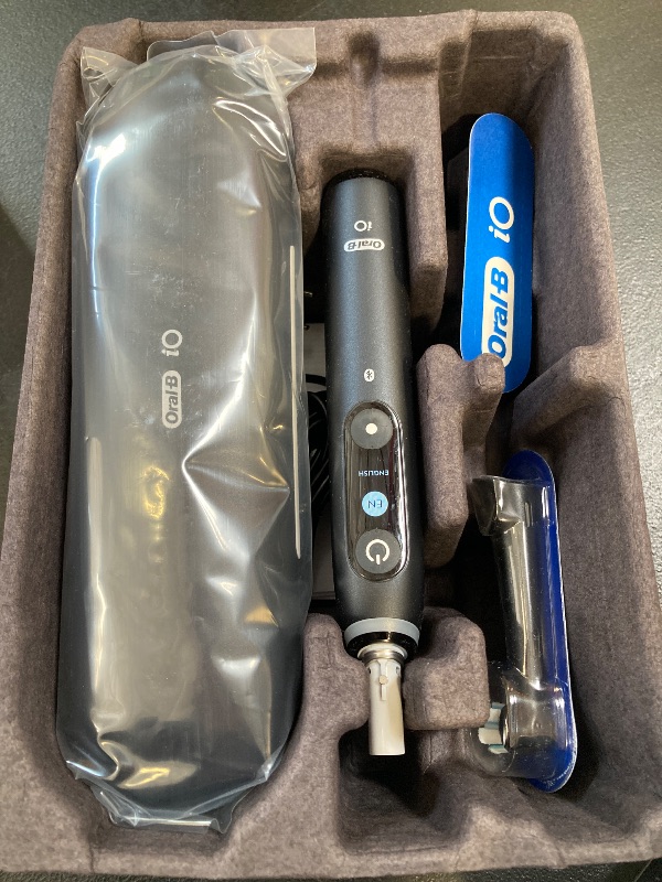 Photo 1 of Oral-B iO Deep Clean + Protect Rechargeable Electric Toothbrush, Black with a iO Series 7 Toothbrush, 2 Replacement Brush Heads, and a Charging Travel Case