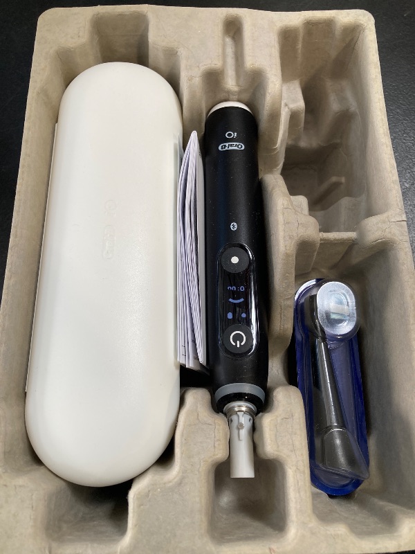 Photo 1 of Oral-B iO Series 6 Rechargeable Electric Toothbrush with Visible Pressure Sensor to Protect Gums, 2 Minute Timer, 5 Cleaning Settings, 1 Replacement Toothbrush Head, and Travel Case, Black
