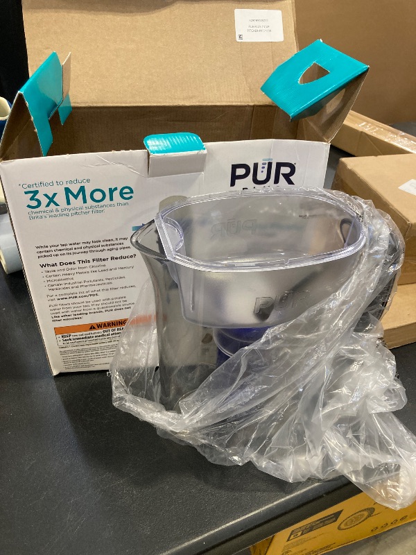 Photo 1 of PUR Plus 7-Cup Water Pitcher, 1 Lead-Reducing Filter, Cleaner, Great-tasting Water, Dishwasher Safe, Powerful Filtration, Filter Change Light Indicator, LockFit Cap Design - Smoke