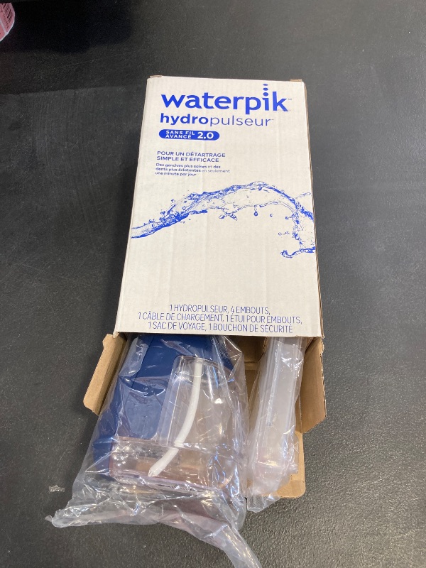Photo 1 of Waterpik Cordless Advanced 2.0 Water Flosser For Teeth, Gums, Braces, Dental Care With Travel Bag and 4 Tips, ADA Accepted, Rechargeable, Portable, and Waterproof, Blue WP-583, Packaging May Vary