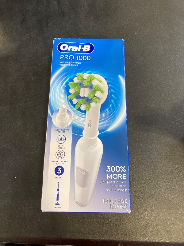 Photo 1 of Oral-B Pro 1000 Rechargeable Electric Toothbrush, White SEALED