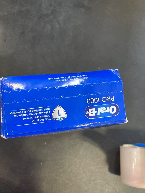 Photo 1 of Oral-B Pro 1000 Rechargeable Electric Toothbrush, White SEALED