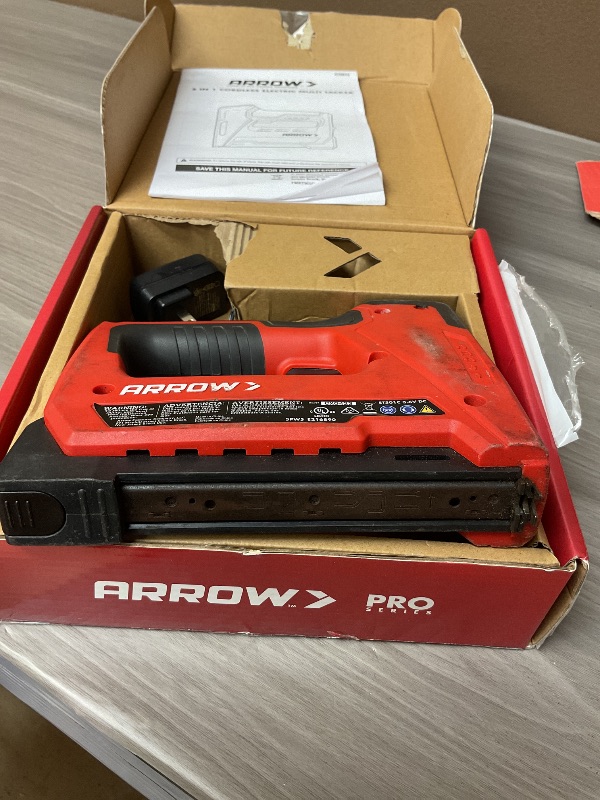 Photo 1 of Arrow ET501C Cordless 5-In-1 Professional Staple and Nail Gun, Battery Powered Wire Stapler and Brad Nailer for Upholstery, Framing, Roofing, Crafts, Fencing, Cable, Black/Red