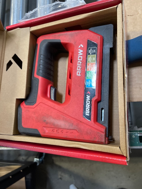 Photo 1 of Arrow ET501C Cordless 5-In-1 Professional Staple and Nail Gun, Battery Powered Wire Stapler and Brad Nailer for Upholstery, Framing, Roofing, Crafts, Fencing, Cable, Black/Red