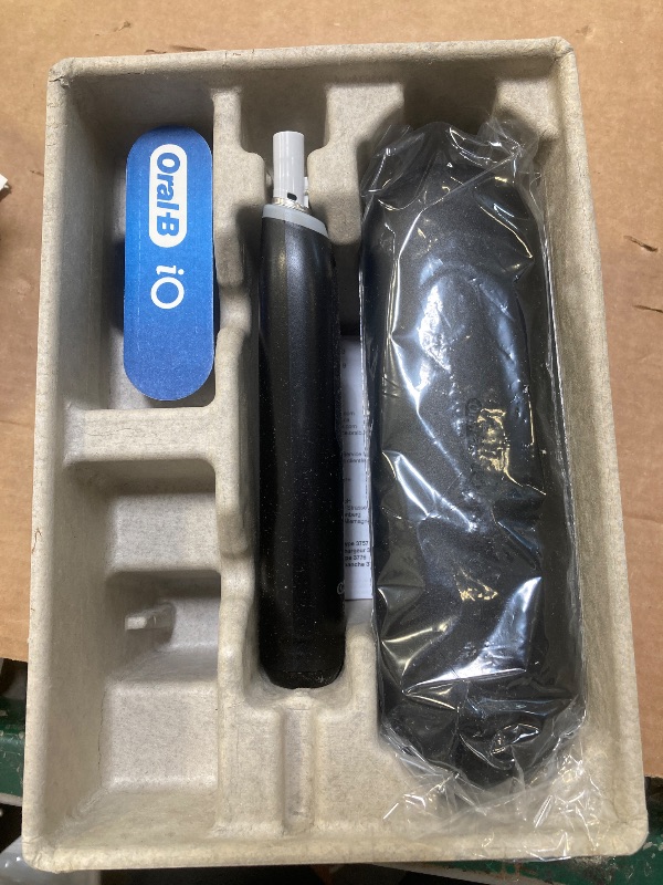 Photo 1 of Oral-B iO Series 5 Rechargeable Electric Toothbrush with Visible Pressure Sensor to Protect Gums, 2 Minute Timer, 5 Cleaning Settings, 1 Replacement Toothbrush Heads, and Travel Case, Black 