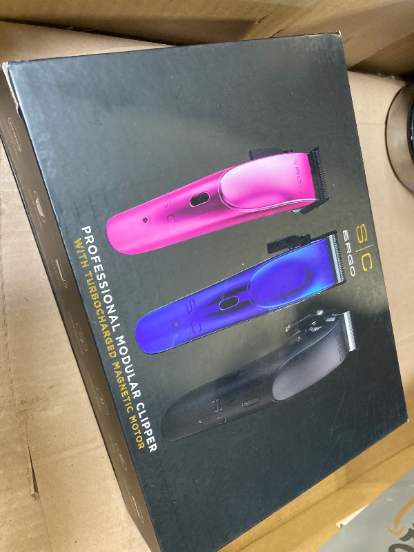 Photo 1 of StyleCraft Ergo Professional Microchipped Magnetic Clipper with 5 Guards, Charging Stand, and 3 Customizable Colored Lids (Black, Pink, Blue)