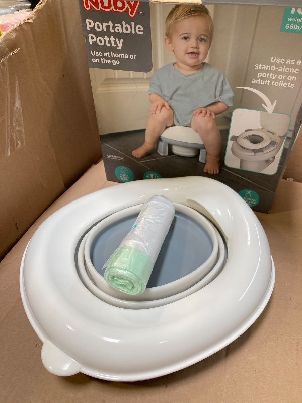 Photo 1 of Nuby On-The-Go Portable Potty Seat - Travel Toilet Seat for Boys and Girls 18+ Months - Includes Storage Bag and Disposable Potty Liners - Toddler Travel Essentials - Toddler Potty Training Toilet