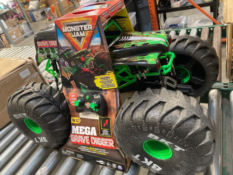 Photo 1 of Monster Jam, Official Mega Grave Digger All-Terrain Remote Control Monster Truck, Over 2 Ft. Tall, 1:6 Scale, Kids Toys for Boys and Girls Ages 4 and Up
