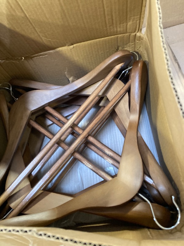 Photo 1 of Uinicor Wooden Coat Hangers - Wide Shoulder Hangers with Non Slip Pants Holder, Heavy Duty, for Men, Women, Suit, Coat, Jacket, Pants (Walnut, 10 Pack)
