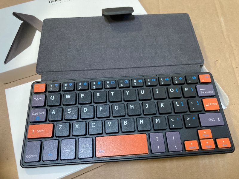 Photo 1 of Doohoeek Universal Bluetooth Mini Keyboard, Wireless Compact Keyboard with Orange Navigation Keys & Any-Angle Stand for Android/iOS/Windows, Dual-Device Keypad for Phones/Galaxy Z Fold/iPad mini