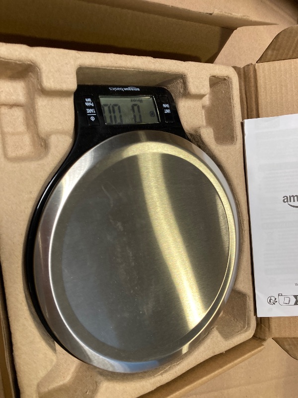 Photo 1 of Amazon Basics Digital Kitchen Scale with LCD Display, Batteries Included, Weighs up to 11 pounds, Black and Stainless Steel