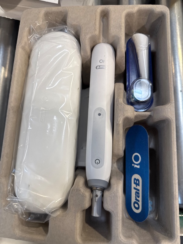 Photo 1 of Oral-B iO Deep Clean Rechargeable Electric Powered Toothbrush, White with iO Series 3 Limited, 2 Brush Heads and Travel Case - Pressure Sensor to Protect Gums - 3 Cleaning Settings - 2 Minute Timer