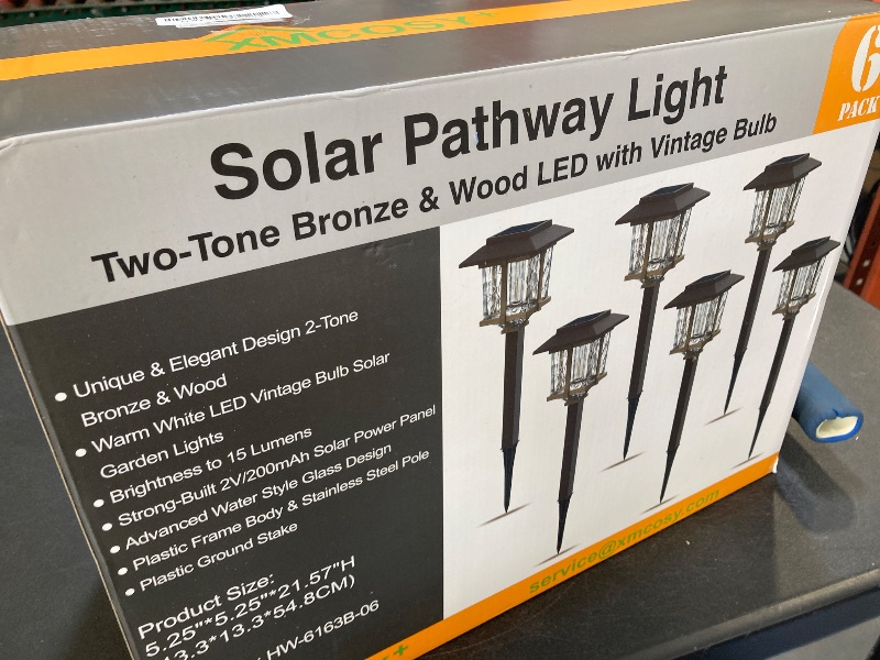 Photo 1 of XMCOSY+ Solar Outdoor Lights Waterproof IP65, Solar-Powered Garden/Yard/Pathway Lights with 20LM Warm White 2-Tone Bronze-Wood Stainless Steel Design for Landscape Driveway Walkway Decorative