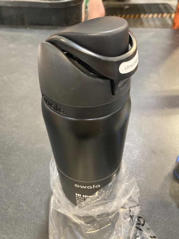 Photo 1 of Owala FreeSip Insulated Stainless Steel Water Bottle with Straw, BPA-Free Sports Water Bottle, Great for Travel, 24 Oz, Black