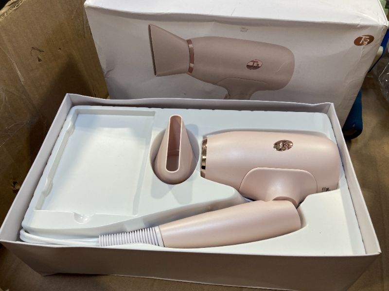 Photo 1 of T3 Afar Lightweight Travel-Size Hair Dryer with Auto Dual Voltage, Folding Handle, Fast Drying, Lightweight and Ergonomic, Frizz Smoothing, Multiple Heat and Speed Combinations