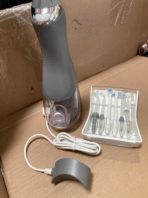 Photo 1 of Waterpik Cordless Advanced 2.0 Water Flosser For Teeth, Gums, Braces, Dental Care With Travel Bag and 4 Tips, ADA Accepted, Rechargeable, Portable, and Waterproof, Gray WP-587, Packaging May Vary