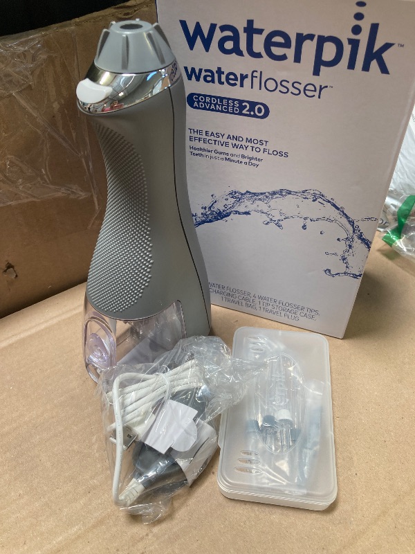 Photo 1 of Waterpik Cordless Advanced 2.0 Water Flosser For Teeth, Gums, Braces, Dental Care With Travel Bag and 4 Tips, ADA Accepted, Rechargeable, Portable, and Waterproof, Gray WP-587, Packaging May Vary