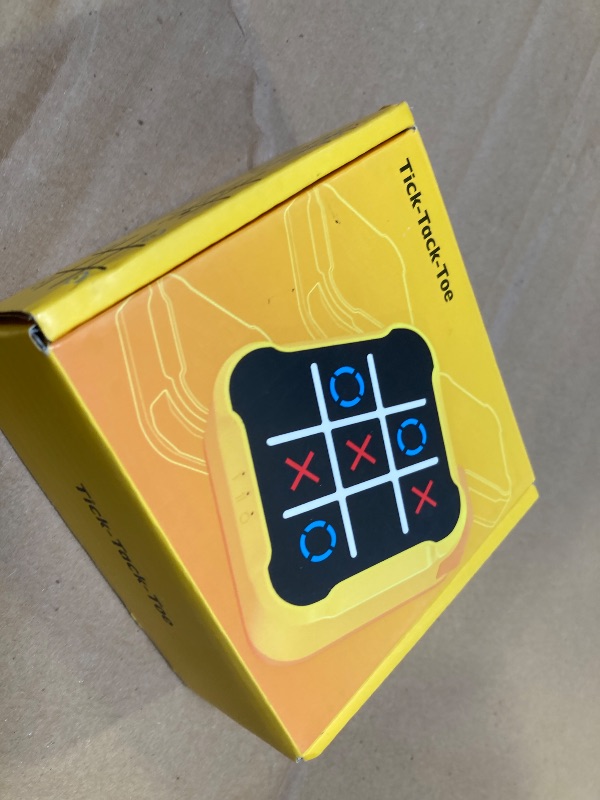 Photo 1 of Tic Tac Toe Game, 4 in 1 Handheld Educational Game Machine, Electronic Tic Tac Toe Game for Education and Memory Growth, Home, Toy Board Game for Kids and Adults (Yellow)