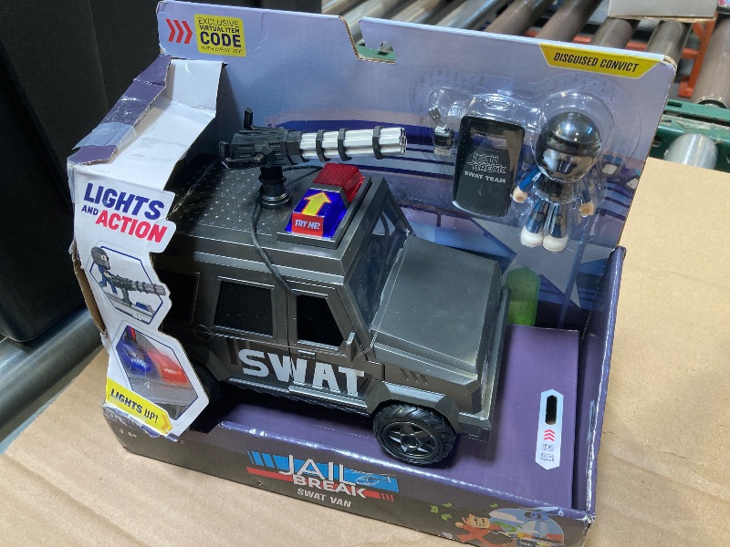 Photo 1 of DevSeries Jailbreak: SWAT Van - 8-Inch Vehicle with Lights, Working Treads, Mounted Machine Gun, 2.75-Inch Figure, and Exclusive Virtual Item Code