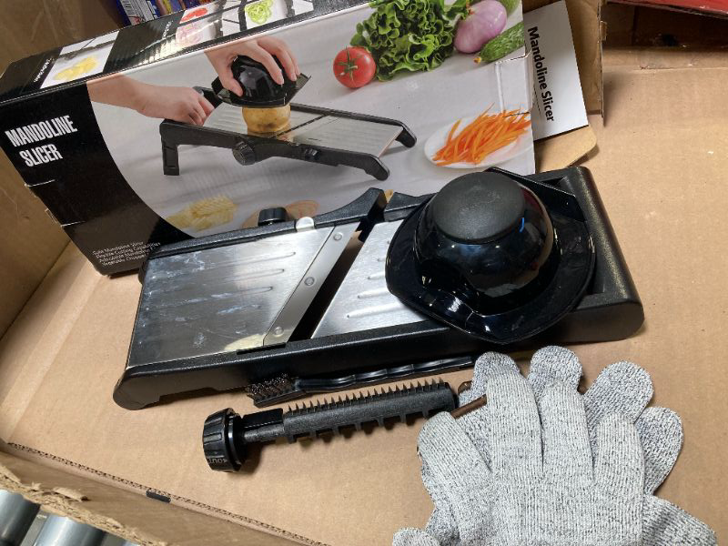 Photo 1 of Mandoline Food slicer for kitchen, Adjustable Stainless Steel Mandoline Vegetable slicer, Food slicer Onion Potato Chip French Fry, 7 in-1 Adjustable Blade, Including 1 Pair Cut-Resistant Gloves