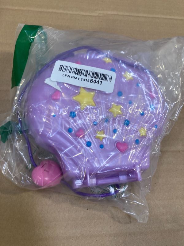 Photo 1 of Polly Pocket Tiny Power Seashell Purse Compact with Wearable Strap, Fun Under-The-Sea Features, Micro Polly and Lila Mermaid Dolls, 2 Accessories & Sticker Sheet; for Ages 4 Years Old & Up