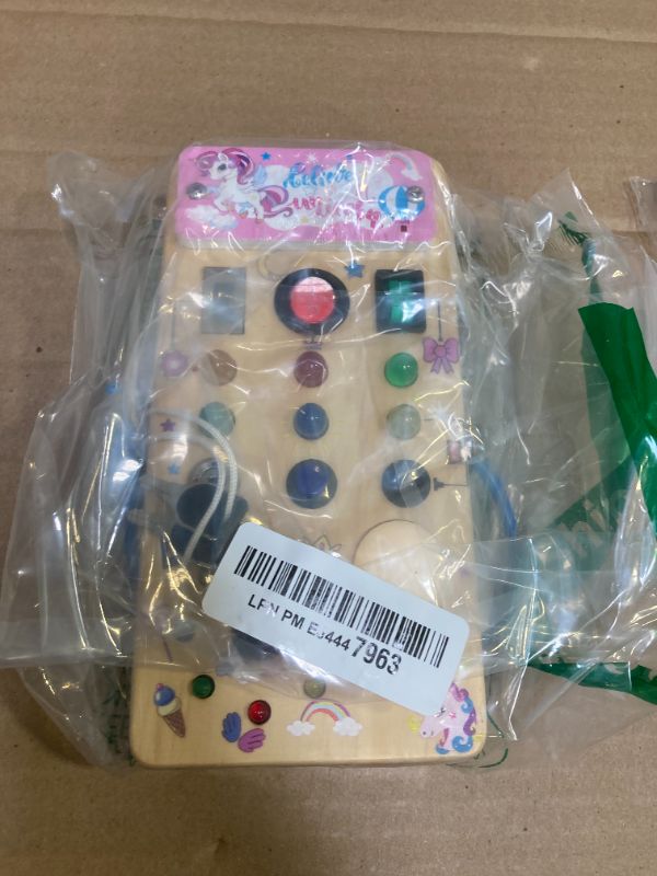 Photo 1 of Unicorn Wooden Busy Board Sensory Toys with 8 LED Light switches,Christmas Travel Toys Montessori Toys for 1 Year Old Babies Toodler