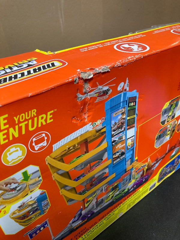 Photo 1 of Matchbox Toy Vehicles & Playset, Transportation Center with 5 Levels, Kid- & Car-Activated Features, 1:64 Scale Taxi, Boat & Helicopter & Food Vendor