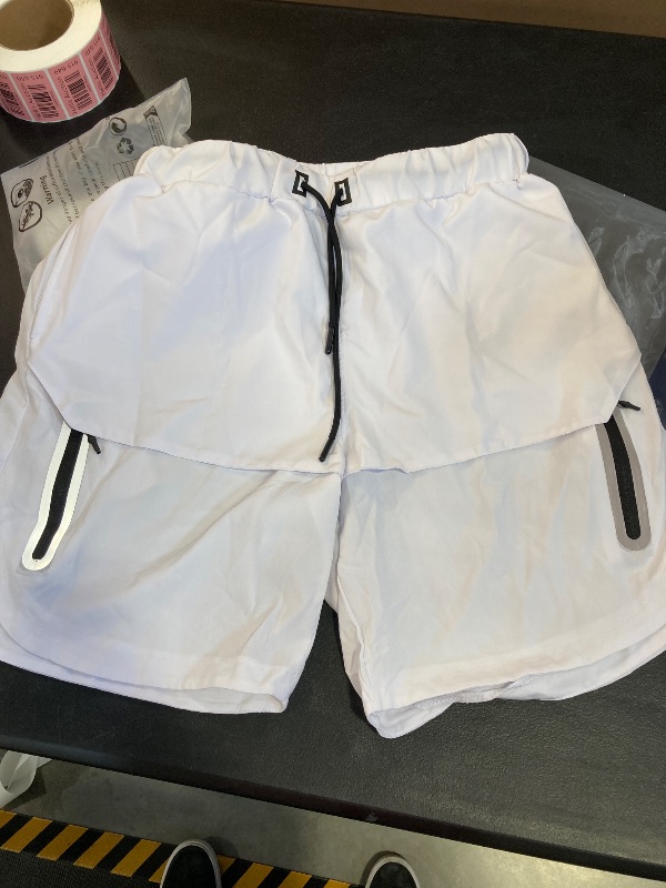 Photo 1 of MENS WHITE AND BLACK SHORTS SIZE UNKNOWN 