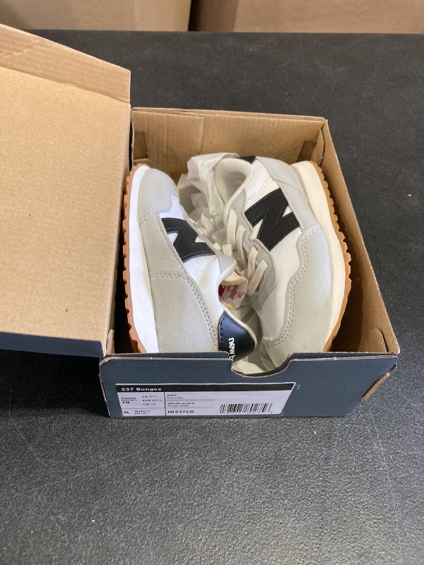 Photo 1 of New Balance Kids 237 Bungee Sneaker, WHITE/BLACK, 10 M Toddler (1-4 Years)