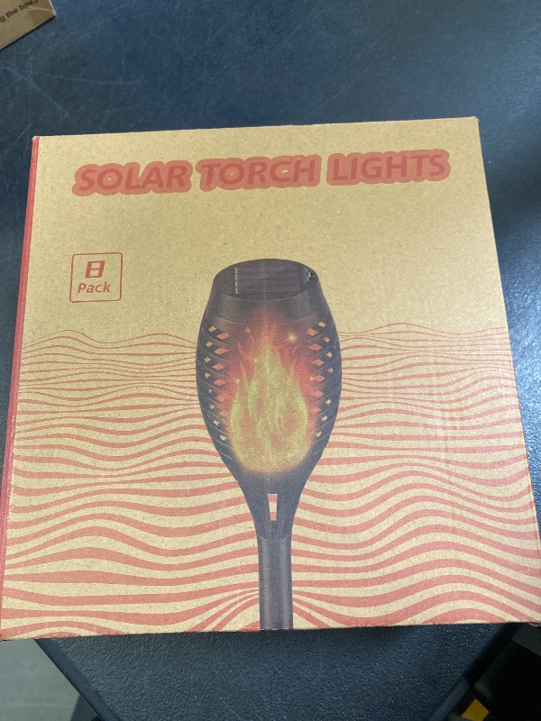 Photo 1 of TomCare 8 Pack Outdoor Flickering Flames Torch Decorative Garden Lights Solar Powered Waterproof Christmas Decorations Lighting for Garden Patio Yard Landscape
