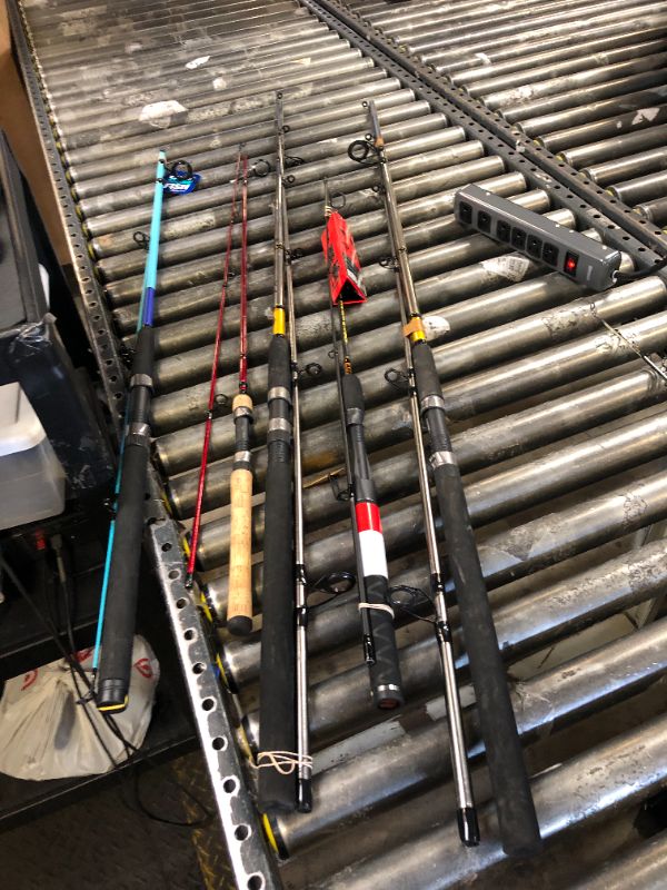 Photo 1 of Five pack of fishing rods, rods only. various states of use. sold as is.