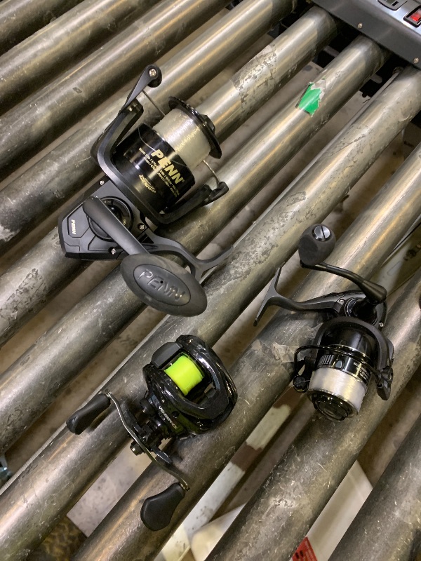 Photo 1 of Three piece fishing reels, various brands, varying levels of use/damage/missing parts.