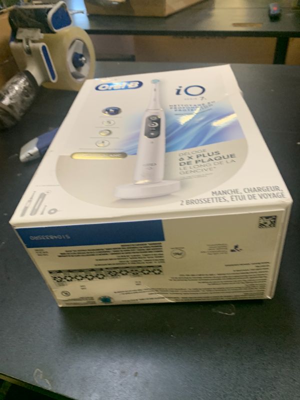 Photo 1 of Oral-B iO Deep Clean + Protect Rechargeable Electric Toothbrush, White with a iO Series 7 Toothbrush, 2 Replacement Brush Heads, and a Charging Travel Case