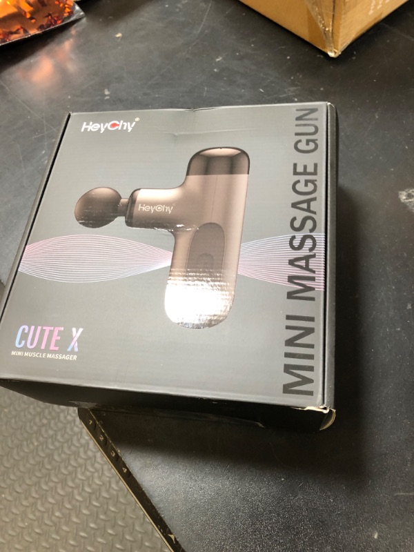 Photo 1 of HEYCHY Mini Massage Gun with Heat, Deep Tissue Massage Gun, Portable Percussion Muscle Massager with 4 Massage Heads for Athletes