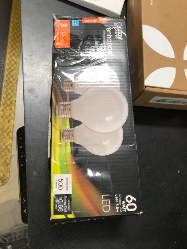 Photo 1 of Feit Electric 60-Watt Equivalent G25 Dimmable Filament LED Energy Star 90+ CRI White Glass Light Bulb, Soft White (3-Pac