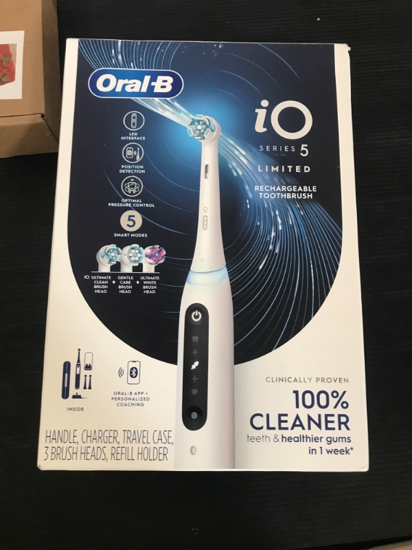 Photo 1 of Oral-B iO Deep Clean + Whiten Rechargeable Electric Toothbrush with Visible Pressure Sensor, 2 Minute Timer, 5 Cleaning Settings, 1 iO5 Limited, 3 Toothbrush Heads, Travel Case & Refill Holder, White