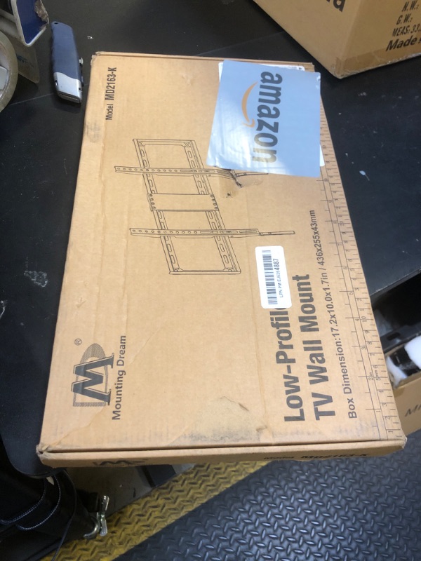 Photo 1 of Mounting Dream TV Mount Fixed for Most 42-84 Inch Flat Screen TVs, TV Wall Mount Bracket up to VESA 600 x 400mm and 132 lbs - Fits 16"/18"/24" Studs - Low Profile and Space Saving MD2163-K