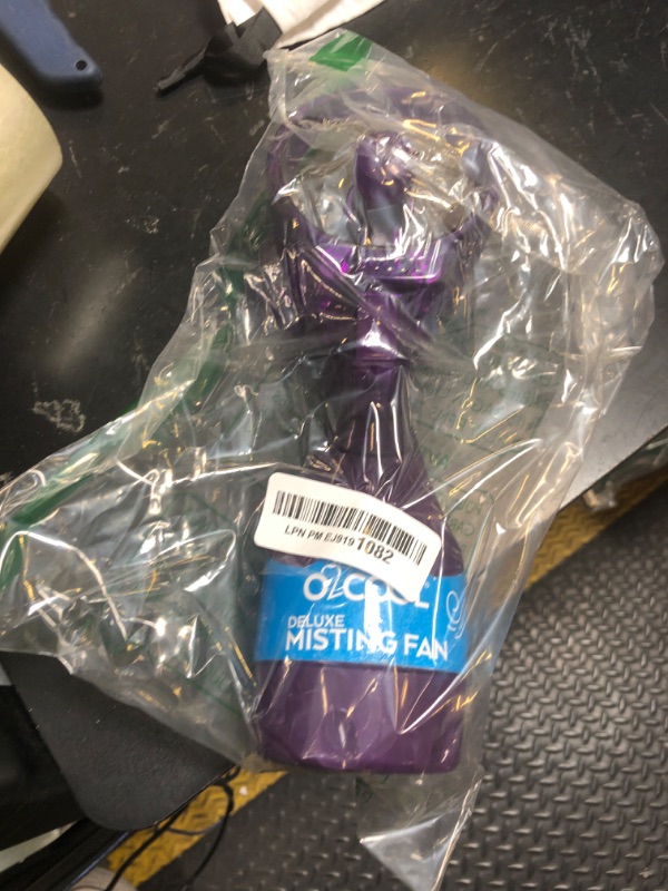 Photo 1 of O2COOL Deluxe Handheld Battery Powered Water Misting Fan (Purple)