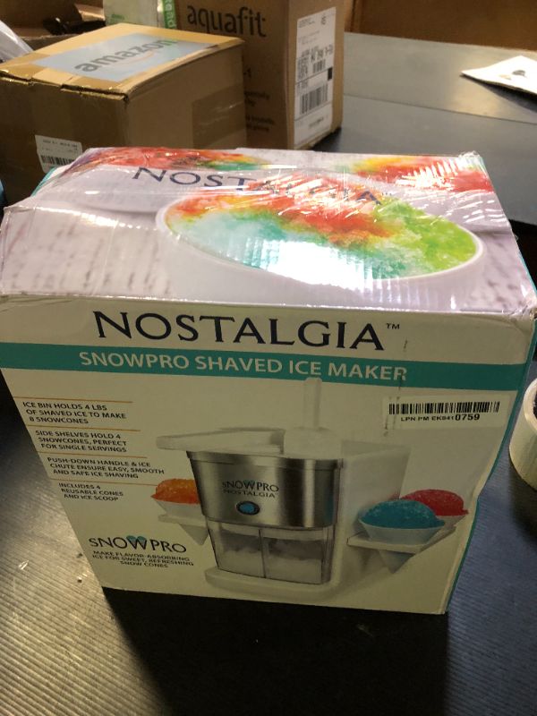 Photo 1 of Nostalgia SnowPro Electric Shaved Ice & Snow Cone Maker 64-Ounce Ice Shaving Capacity, 4 Reusable Cones, Side Shelves, and Scoop Included