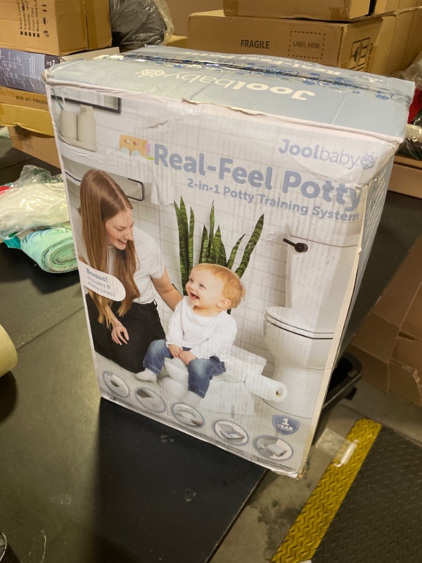 Photo 1 of Real Feel 2-in-1 Potty with Wipes Storage, Flushing Sounds & Disposable Liners - Realistic Toilet - Easy to Clean & Assemble - Jool Baby (Gray)