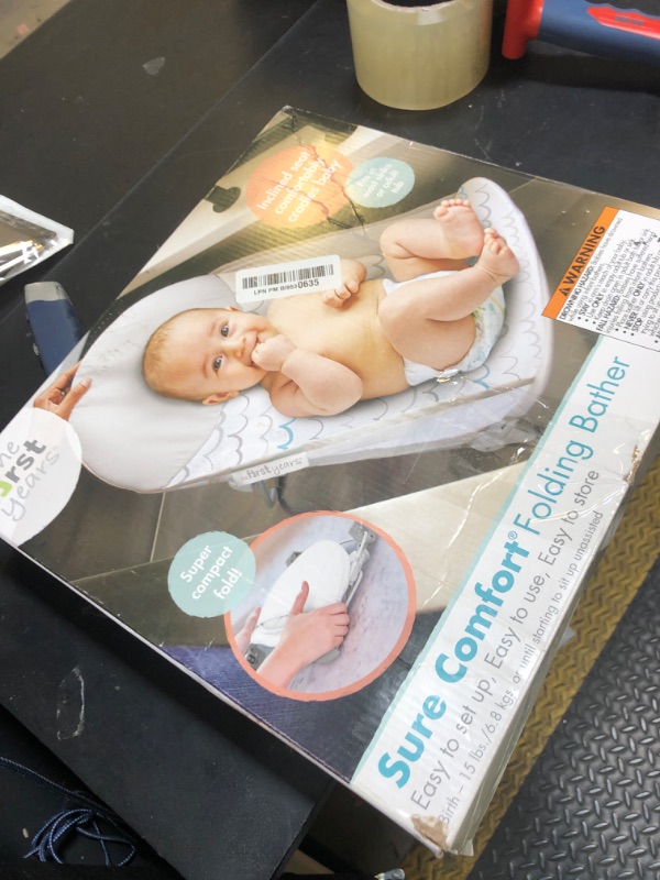 Photo 1 of The First Years Sure Comfort Folding Baby Bather - Baby to Toddler Bath Tub - No-Slip Seat - for Sink or Tub Use