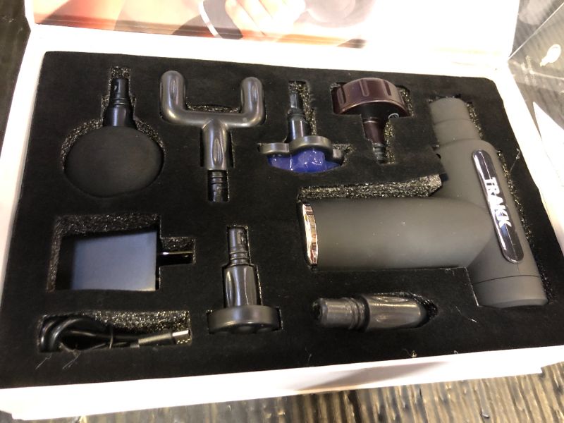 Photo 1 of TRAKK Compact Hot & Cold Massage Gun- Multiple Modes and Speeds-6 Heads
